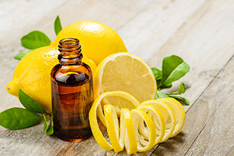 Lemon Essential Oil and lemons