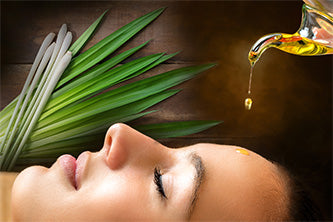 women with eo being dripped on forehead