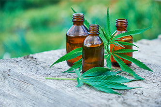 hemp leaves and glass bottles