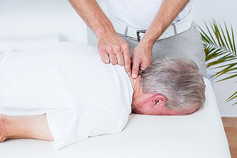 man being massaged at spa