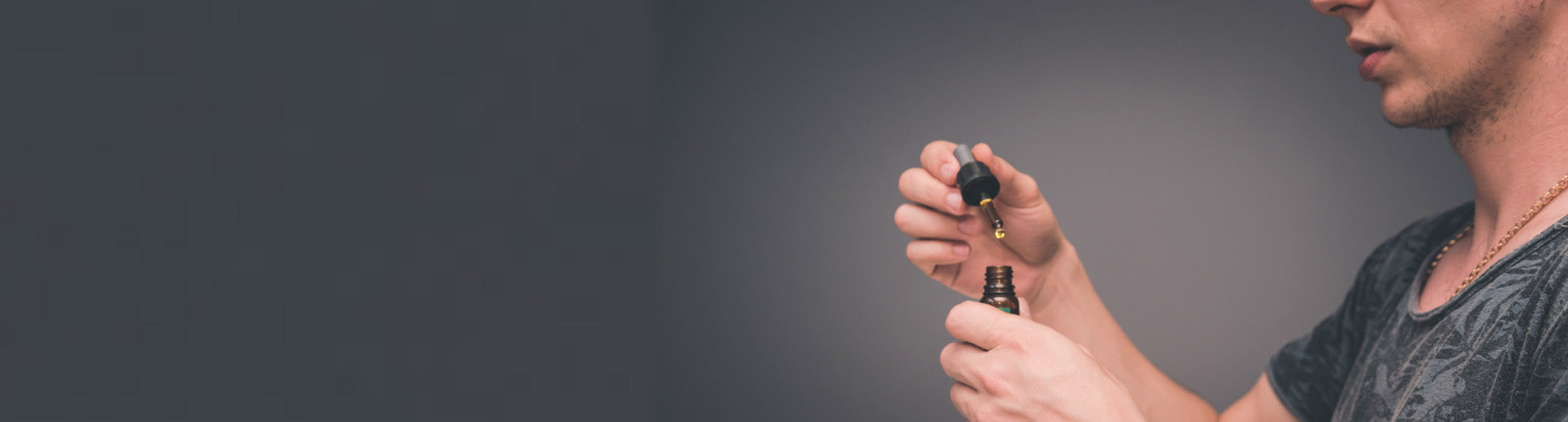 Image of man looking at cbd oil