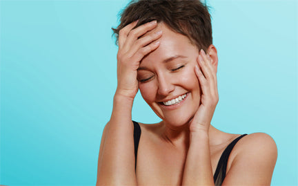 woman feeling her face