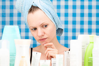 woman and looking at skin products